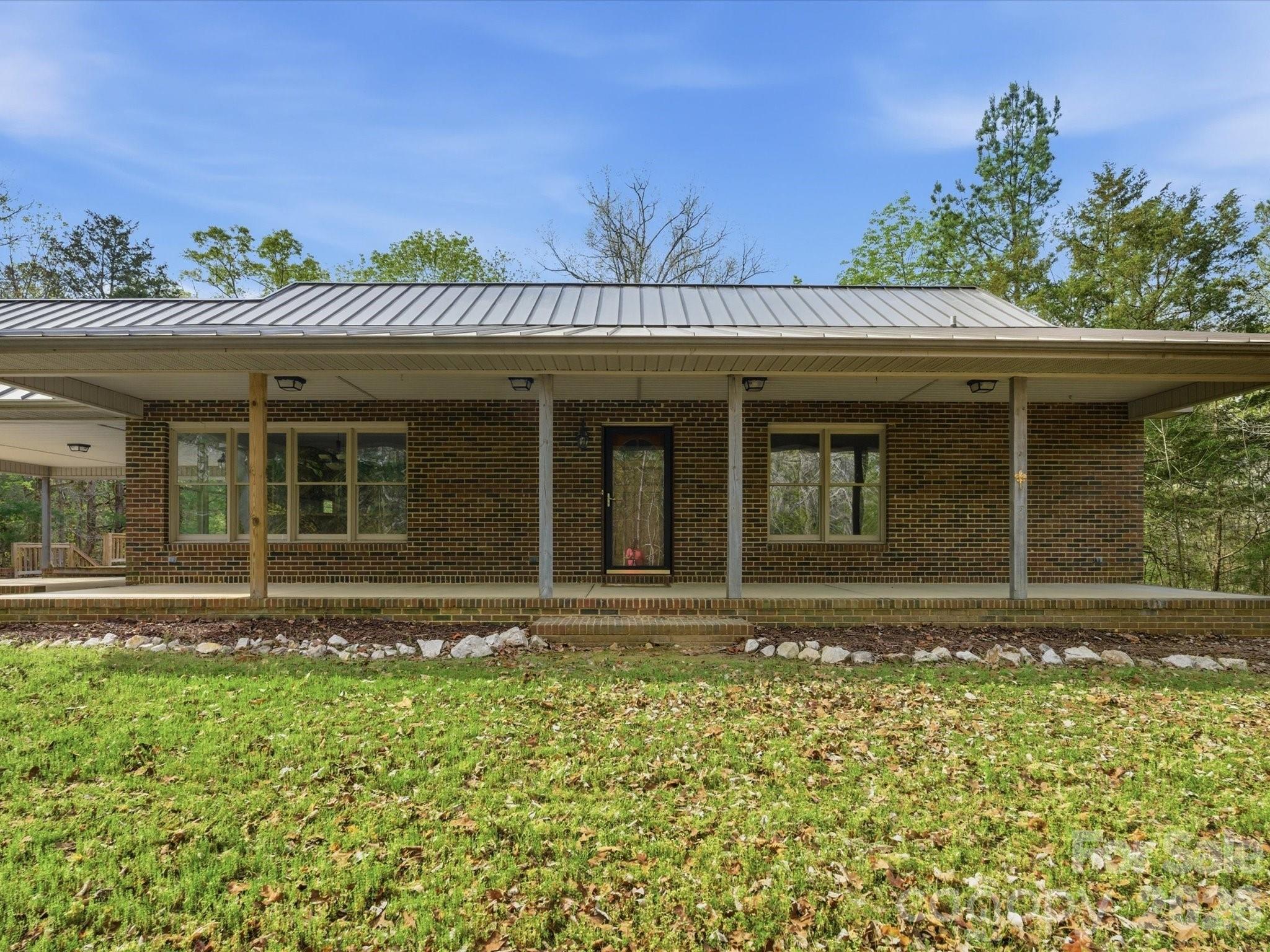 3090 Goblet Road Richburg, SC 29729 - Photo 3 of 48 a view of a house with a large window and plants