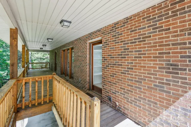 a view of balcony with wooden floor