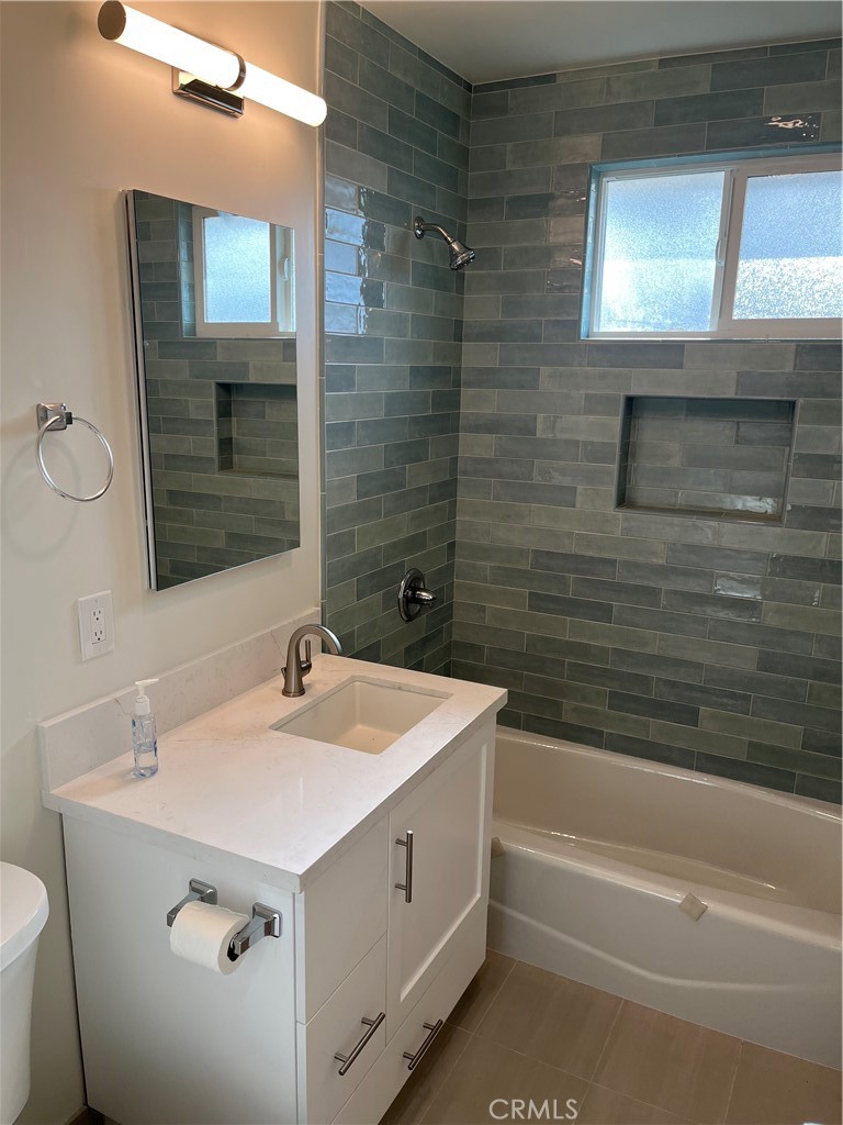 717 Naramore Way Redondo Beach, CA 90278 - Photo 11 of 16 a bathroom with a sink and a mirror