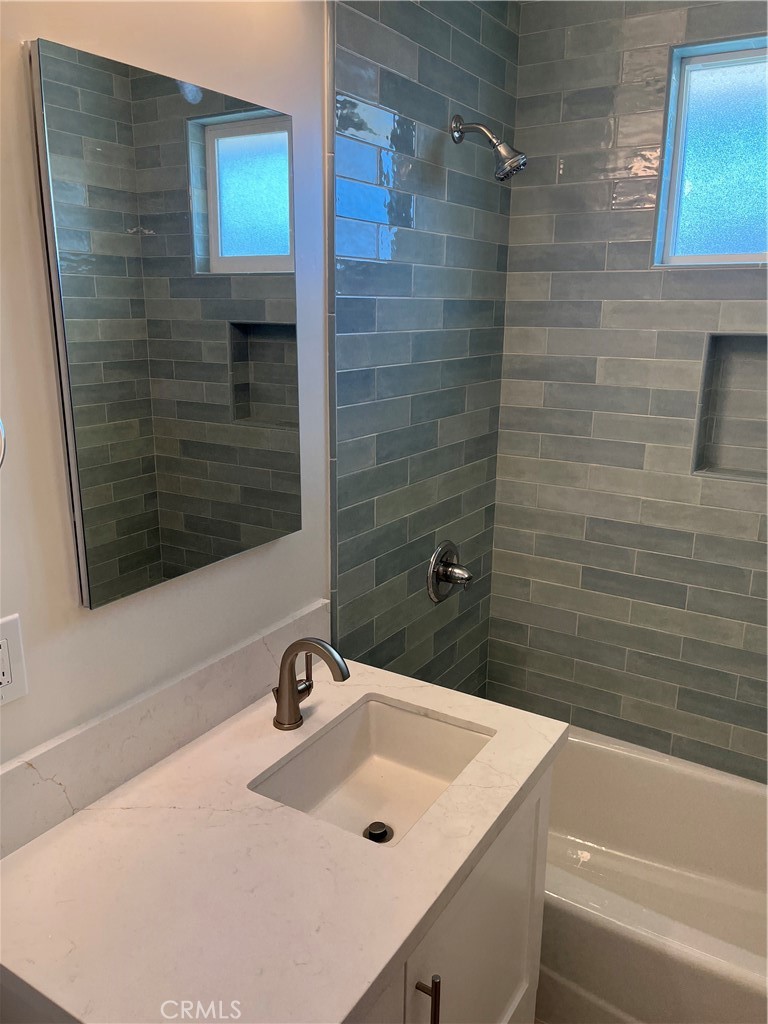 717 Naramore Way Redondo Beach, CA 90278 - Photo 12 of 16 a bathroom with a sink and a mirror