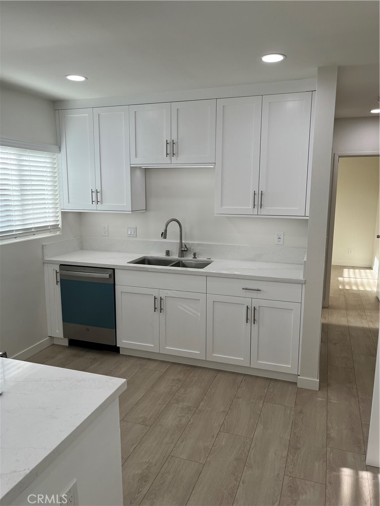 717 Naramore Way Redondo Beach, CA 90278 - Photo 3 of 16 a kitchen with white cabinets