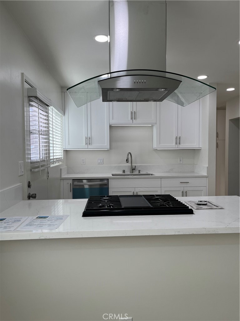 717 Naramore Way Redondo Beach, CA 90278 - Photo 4 of 16 a kitchen with stainless steel appliances granite countertop a sink a stove and a refrigerator