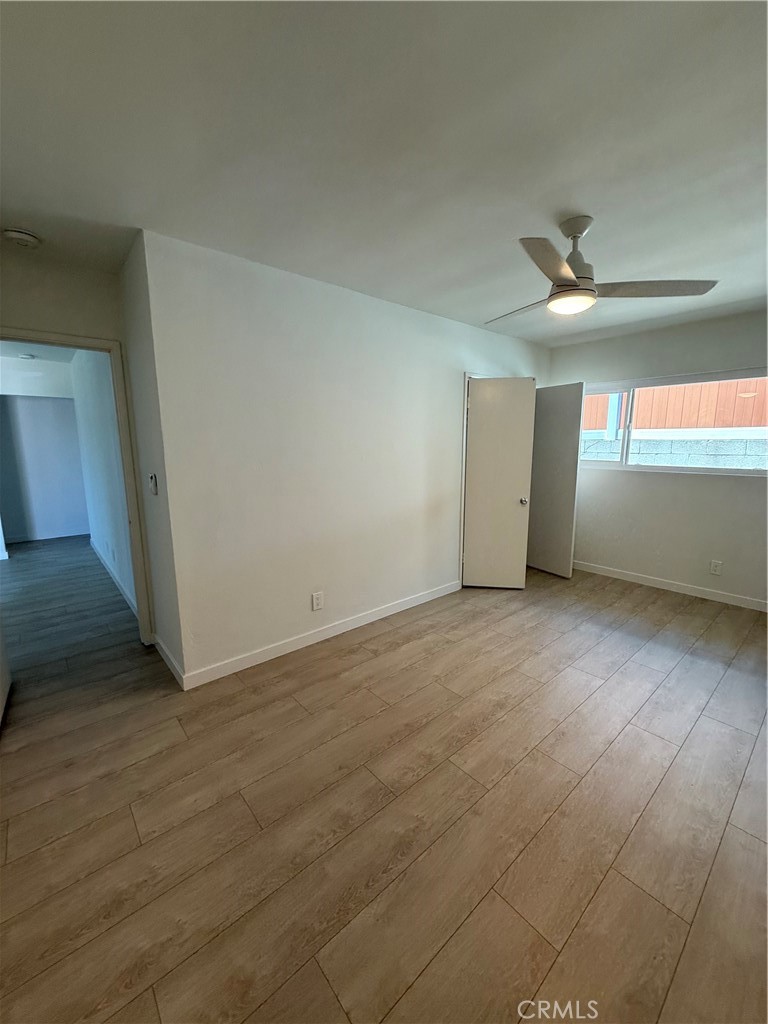 717 Naramore Way Redondo Beach, CA 90278 - Photo 7 of 16 wooden floor in an empty room with a window