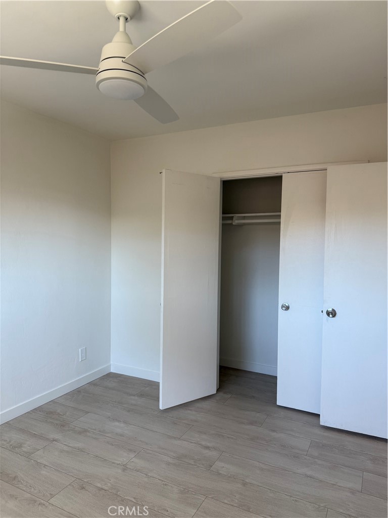 717 Naramore Way Redondo Beach, CA 90278 - Photo 8 of 16 a view of an empty room with wooden floor