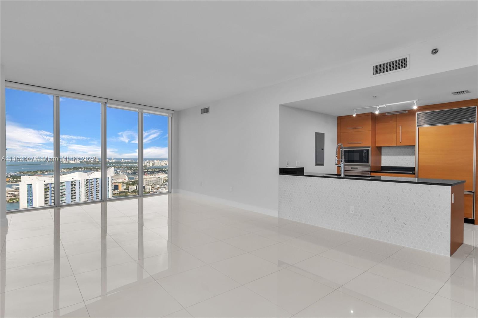 465 Brickell Avenue, Unit 5002 Miami, FL 33131 - Photo 11 of 26 a view of a living room with a large window