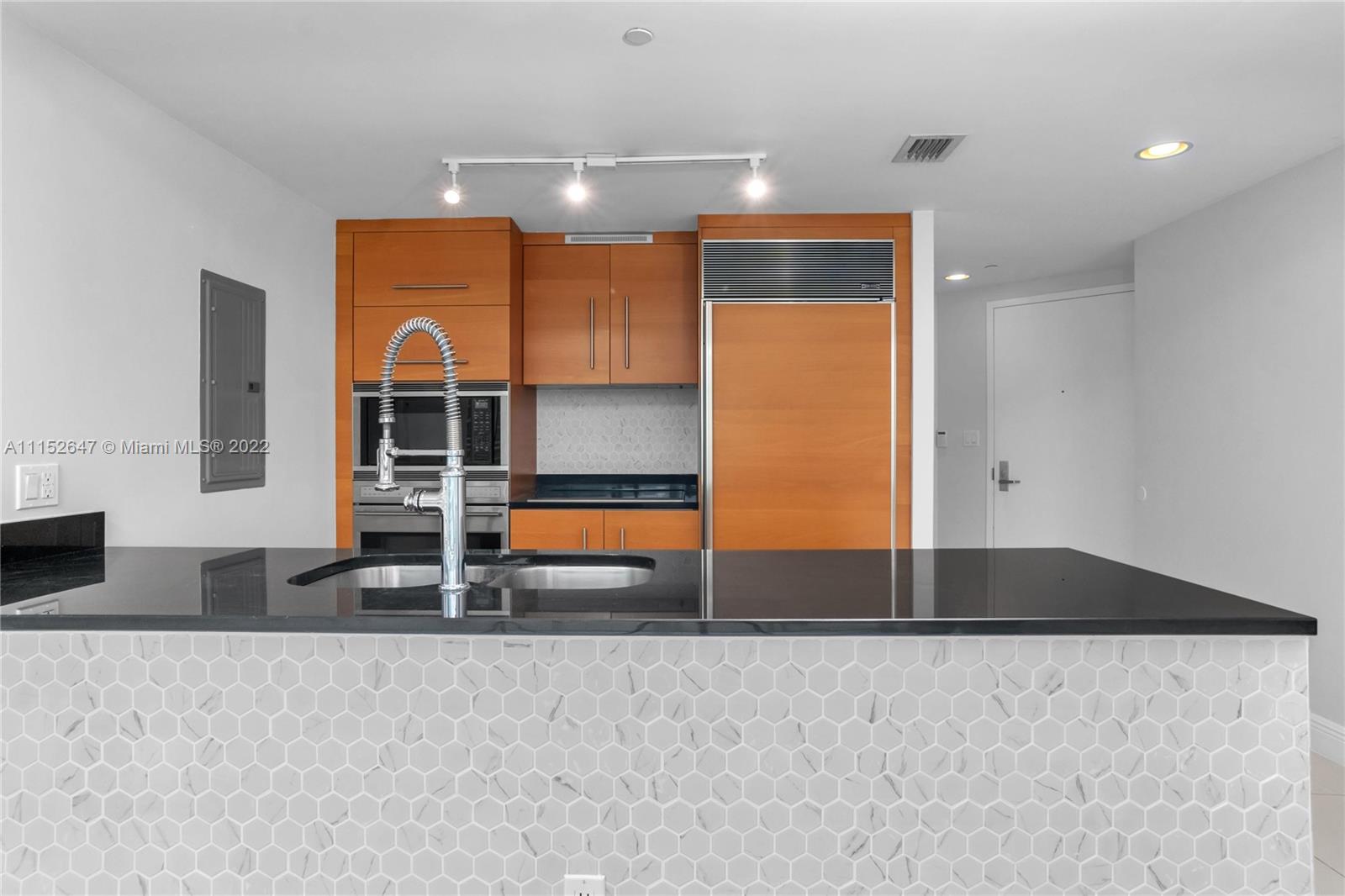 465 Brickell Avenue, Unit 5002 Miami, FL 33131 - Photo 12 of 26 a view of wooden floor and windows in a room