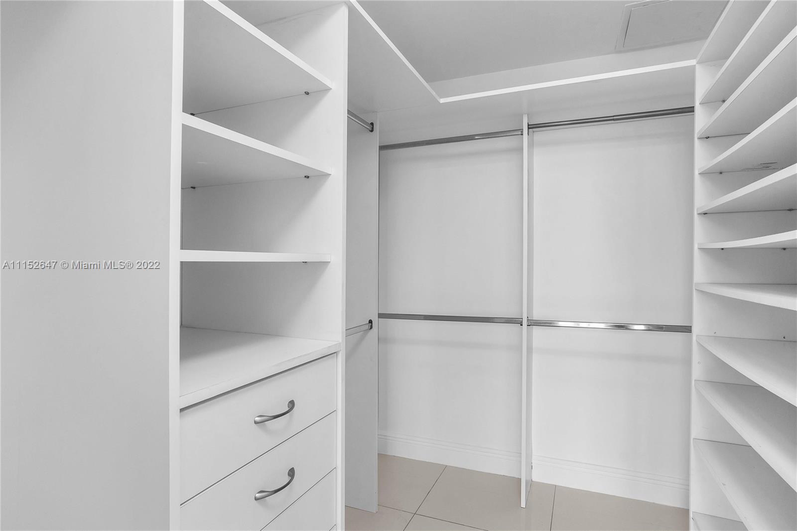 465 Brickell Avenue, Unit 5002 Miami, FL 33131 - Photo 19 of 26 a view of an empty walk in closet