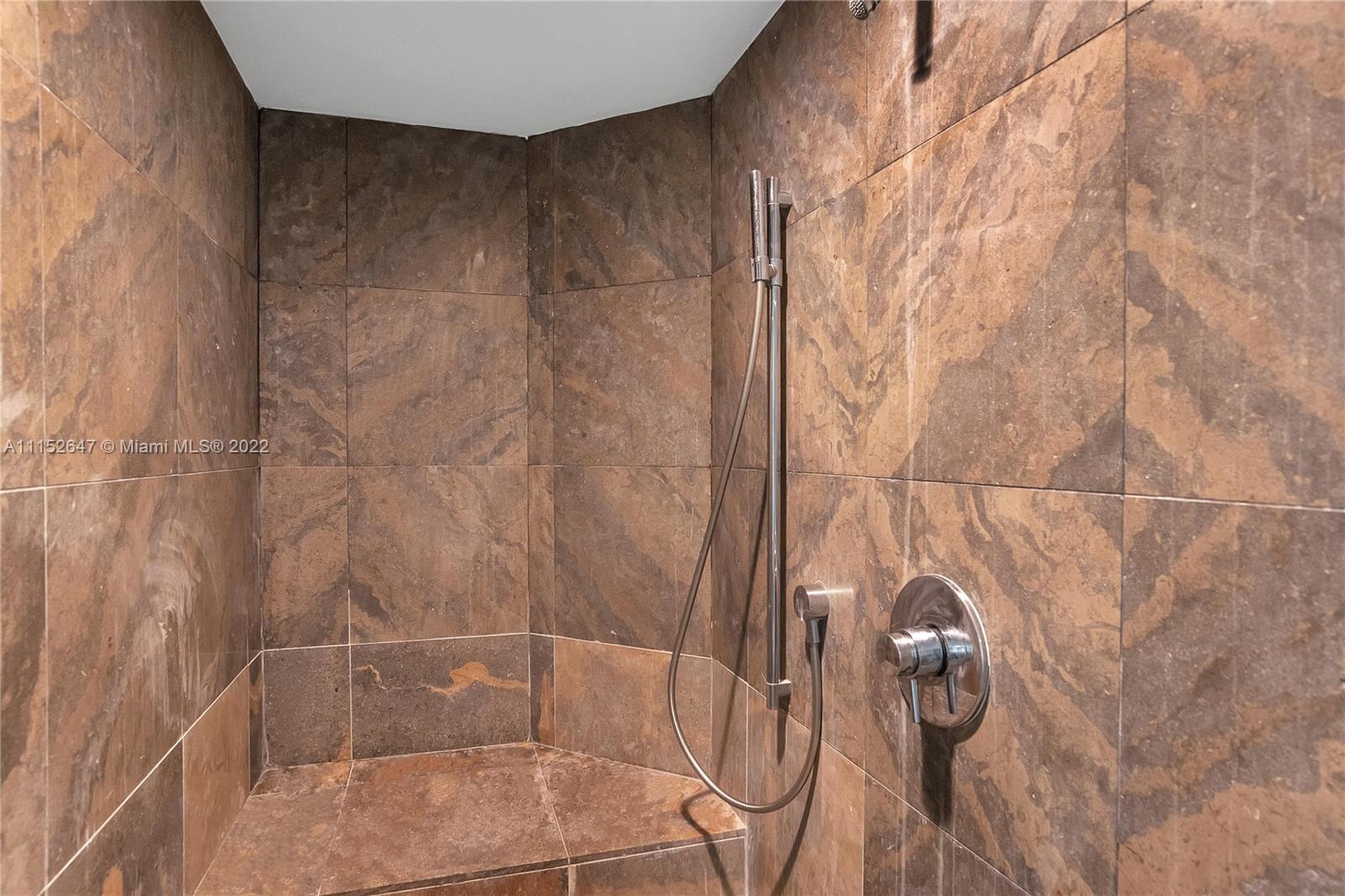 465 Brickell Avenue, Unit 5002 Miami, FL 33131 - Photo 22 of 26 a bathroom with a shower