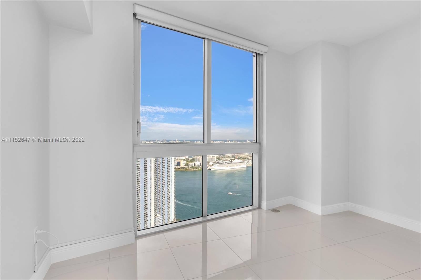 465 Brickell Avenue, Unit 5002 Miami, FL 33131 - Photo 23 of 26 wooden floor and window