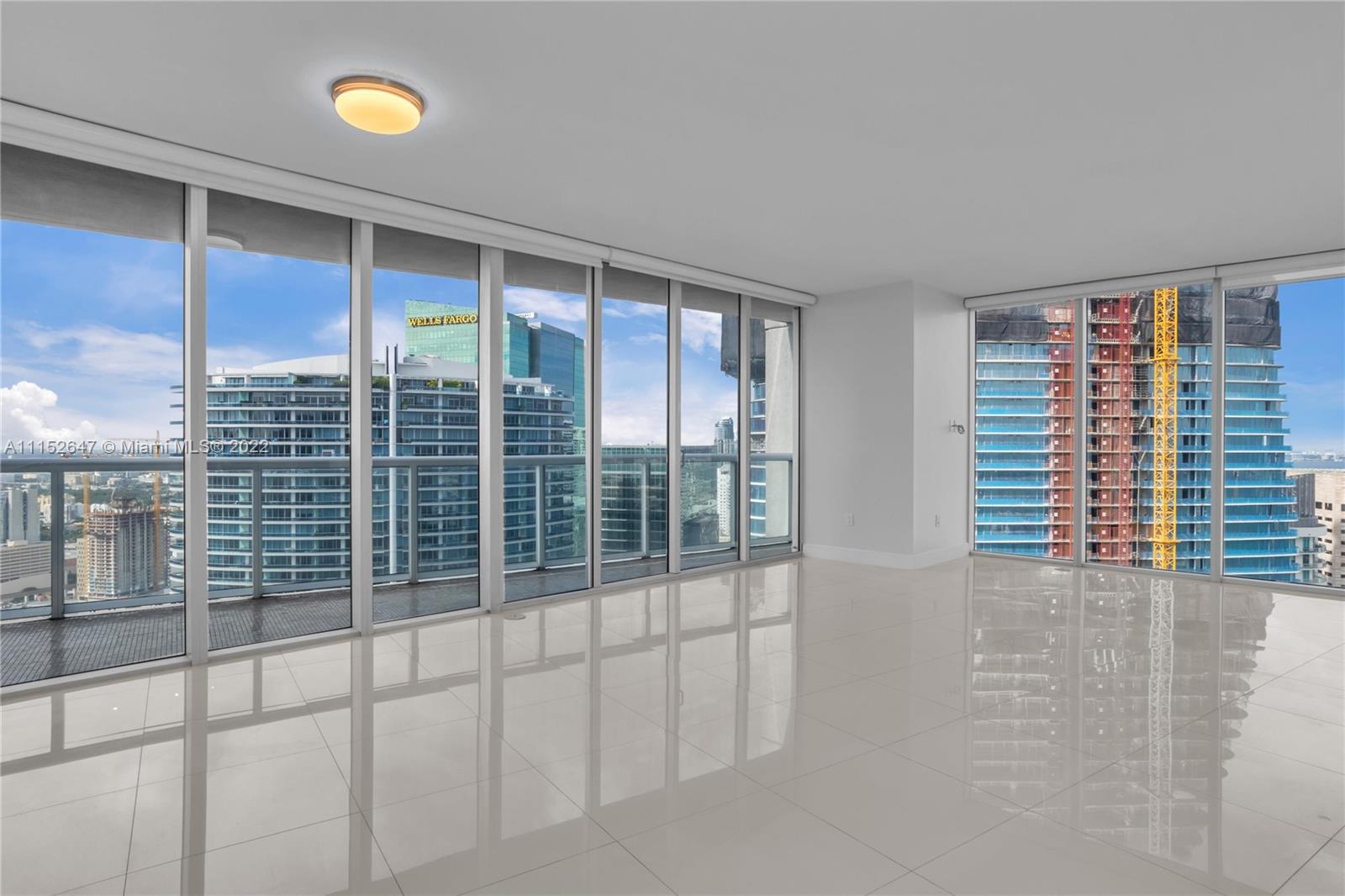 465 Brickell Avenue, Unit 5002 Miami, FL 33131 - Photo 5 of 26 a view of empty room with windows