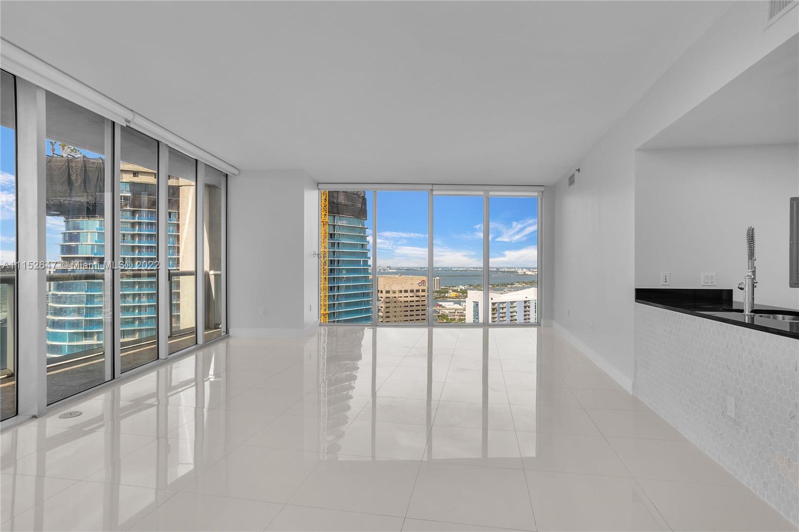 465 Brickell Avenue, Unit 5002 Miami, FL 33131 - Photo 6 of 26 a view of an empty room with a window