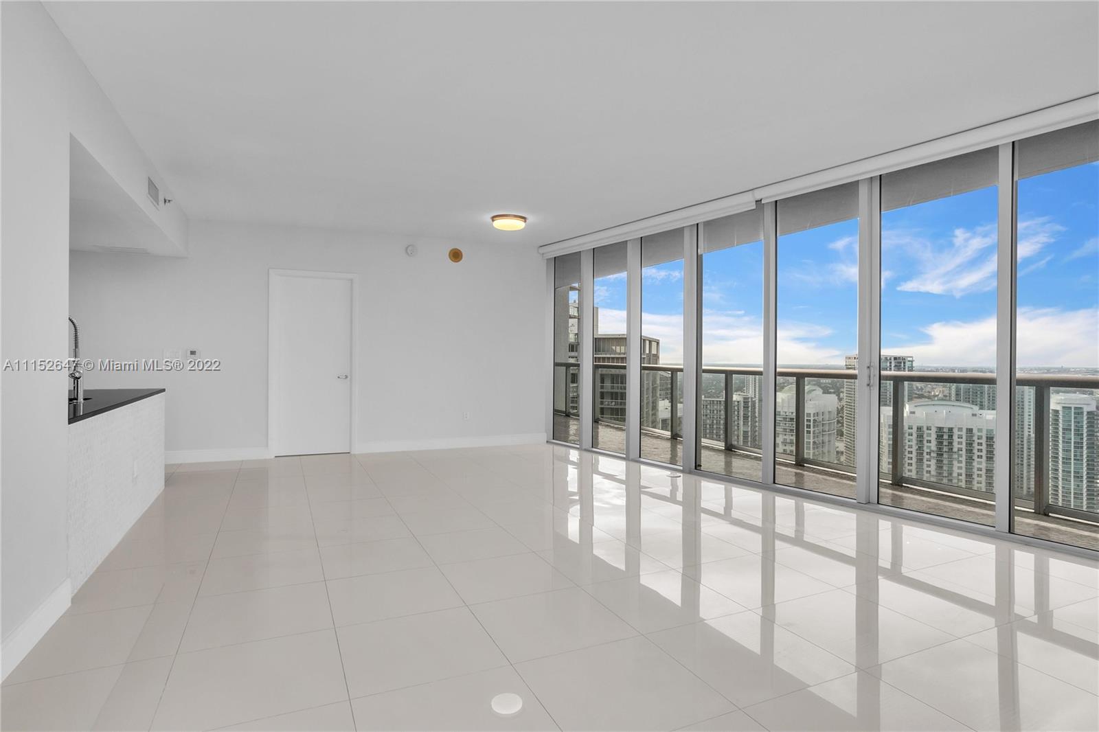 465 Brickell Avenue, Unit 5002 Miami, FL 33131 - Photo 8 of 26 a view of an empty room with a window