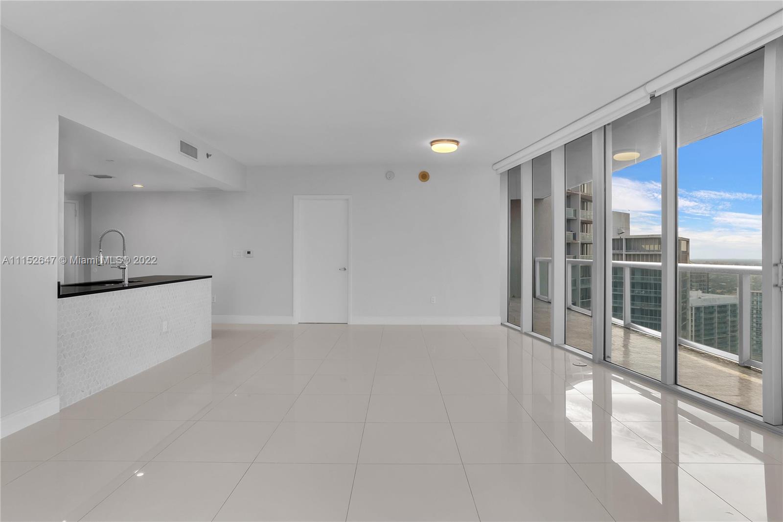 465 Brickell Avenue, Unit 5002 Miami, FL 33131 - Photo 9 of 26 a view of an empty room with a window