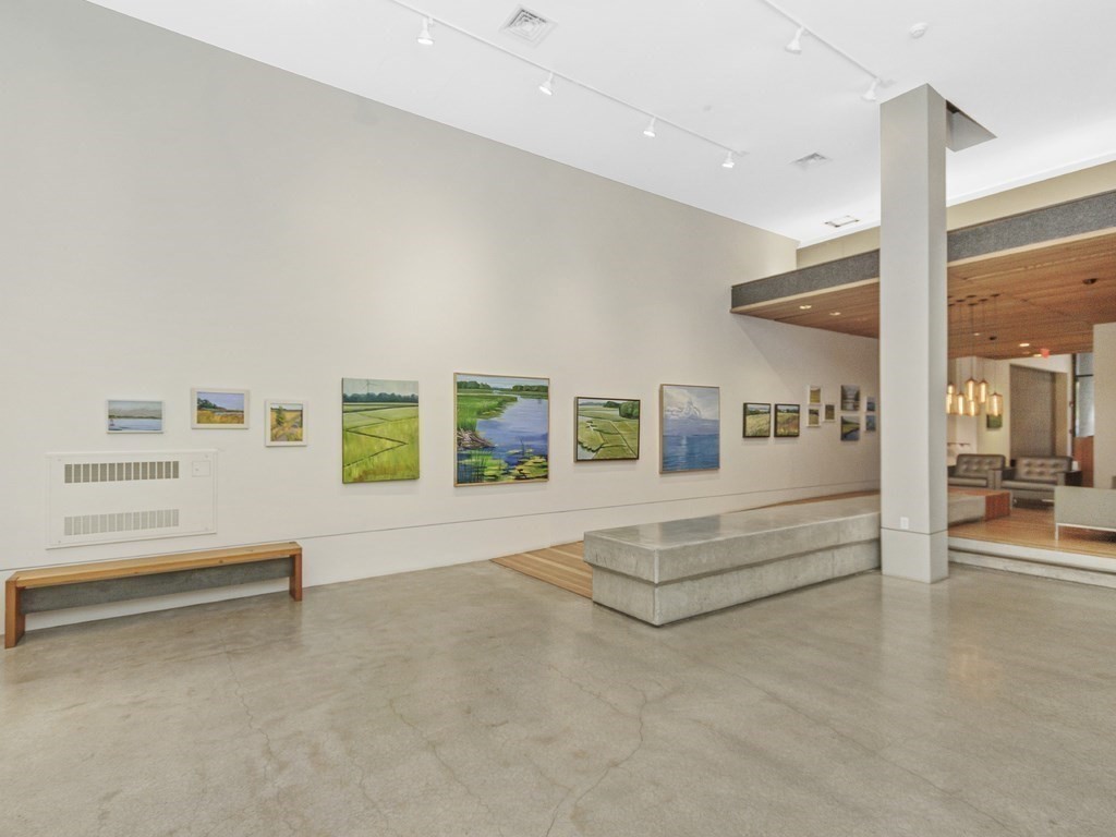 346 Congress Street, Unit 302 Boston, MA 02210 - Photo 5 of 22 a view of living room with furniture and floor to ceiling window