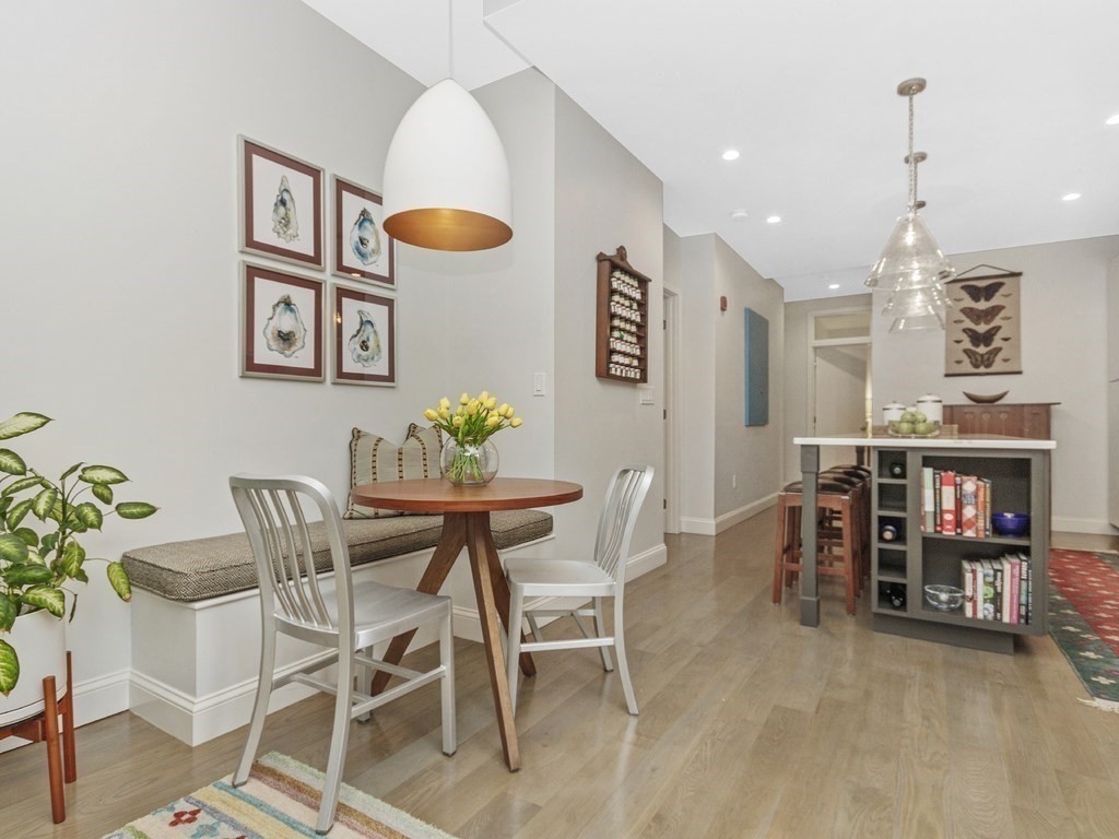 346 Congress Street, Unit 302 Boston, MA 02210 - Photo 10 of 22 a view of a dining room with furniture
