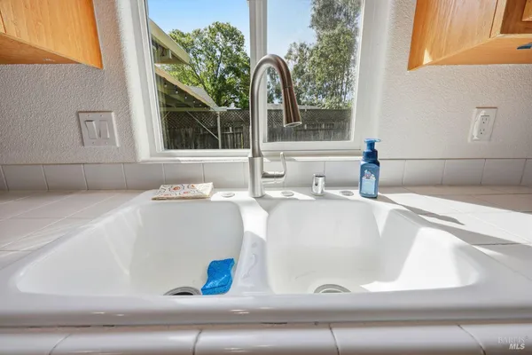 a kitchen with a sink stove and cabinets