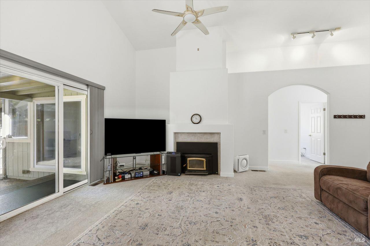 164 Fulton Place Windsor, CA 95492 - Photo 16 of 50 a living room with fireplace furniture and a flat screen tv