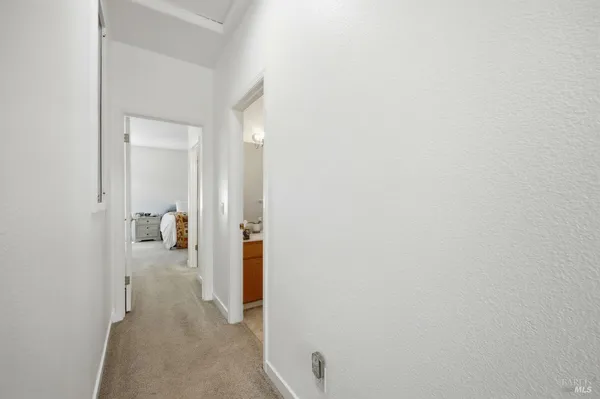 a bedroom with a bed and flat screen tv