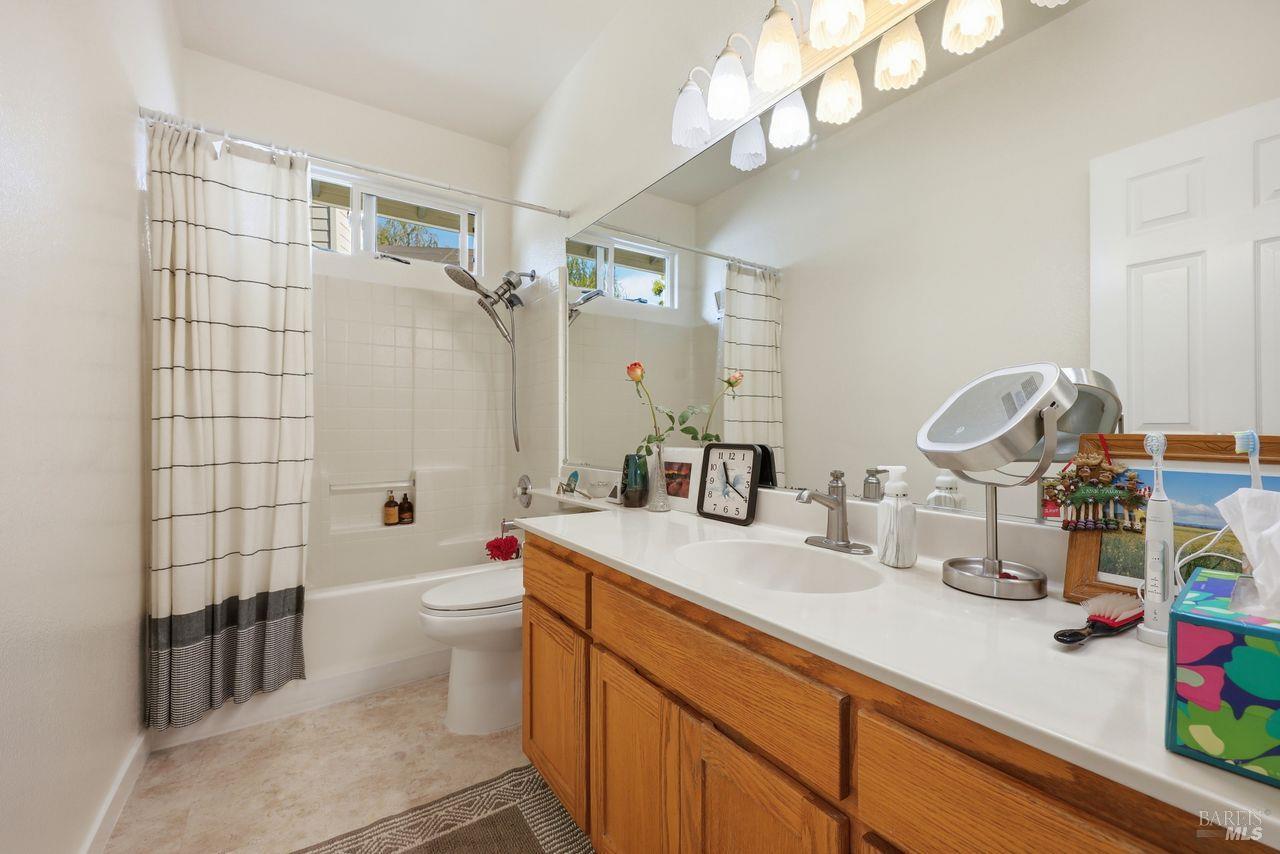164 Fulton Place Windsor, CA 95492 - Photo 21 of 50 a bathroom with a sink a toilet and shower