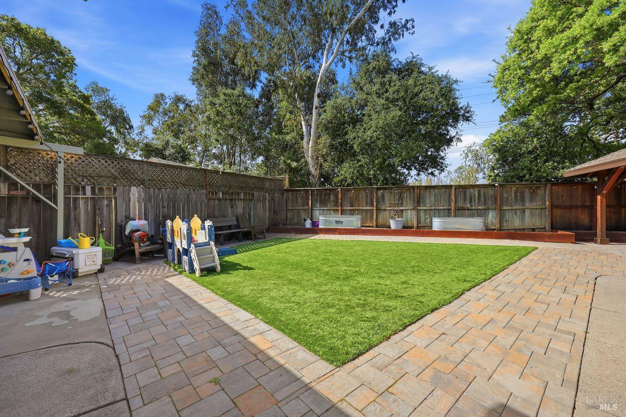 164 Fulton Place Windsor, CA 95492 - Photo 3 of 50 a view of a backyard with a patio and a garden