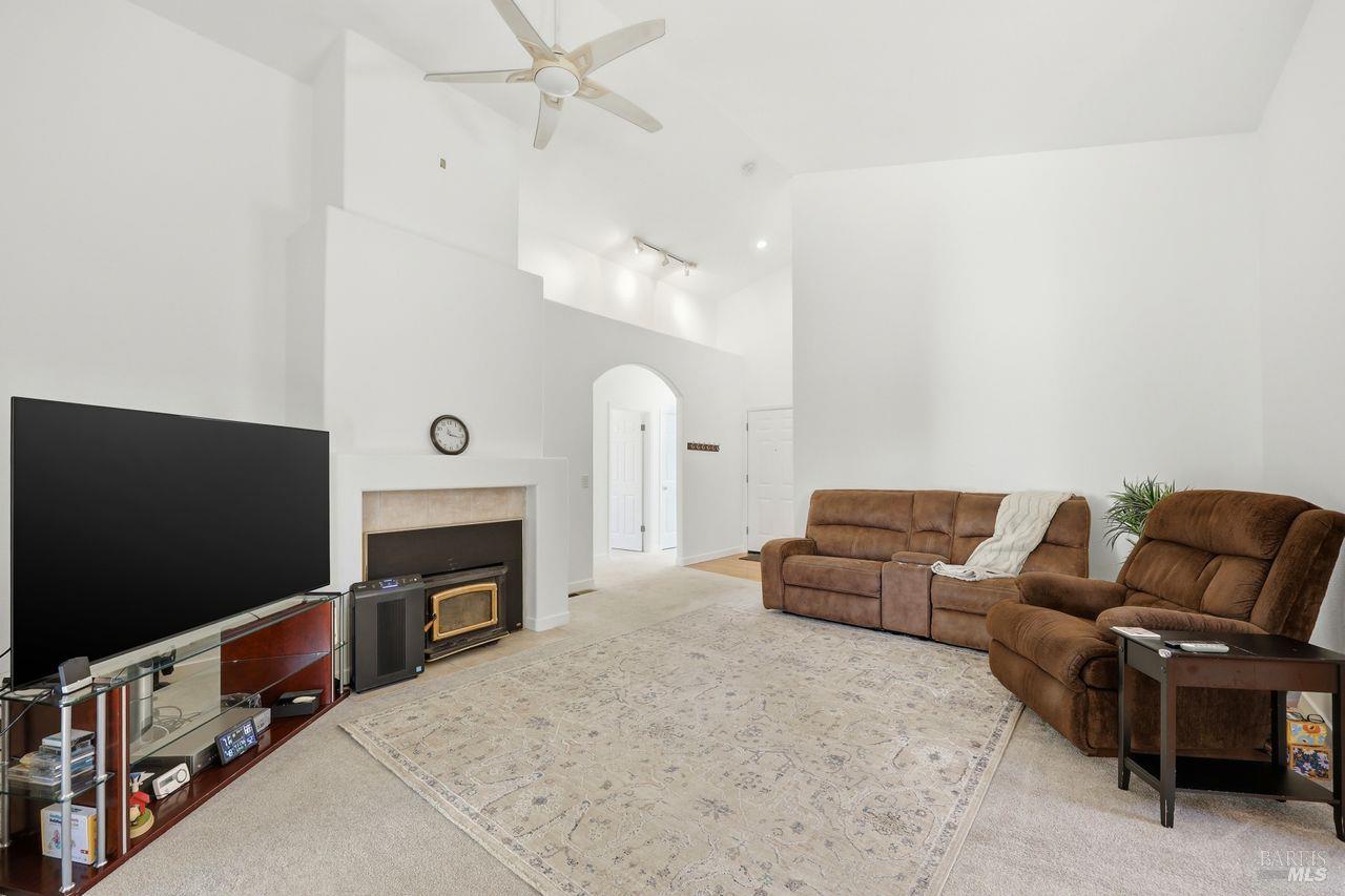 164 Fulton Place Windsor, CA 95492 - Photo 6 of 50 a living room with furniture a flat screen tv and a fireplace