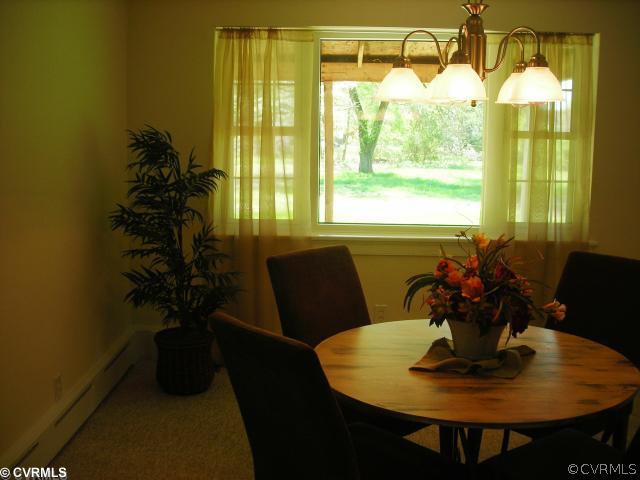 9131 Rutland Road Mechanicsville, VA 23116 - Photo 7 of 12 Dining Room - OPEN TO LIVING ROOM AND OFFERS 90" WINDOW OVERLOOKING LOVELY BACK YARD...