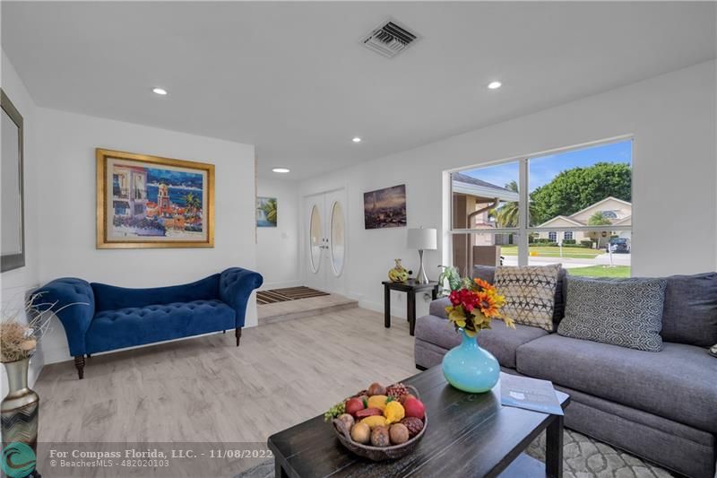 22341 Sea Bass Drive Boca Raton, FL 33428 - Photo 11 of 52 a living room with furniture and a large window