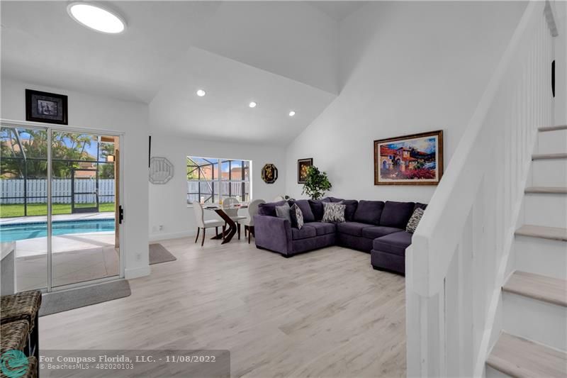 22341 Sea Bass Drive Boca Raton, FL 33428 - Photo 12 of 52 a living room with furniture and a flat screen tv