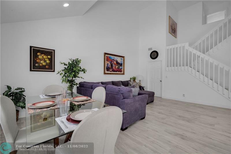 22341 Sea Bass Drive Boca Raton, FL 33428 - Photo 15 of 52 a living room with furniture and a potted plant