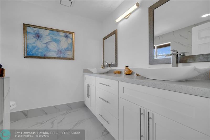 22341 Sea Bass Drive Boca Raton, FL 33428 - Photo 26 of 52 a room with cabinets and painting on the wall