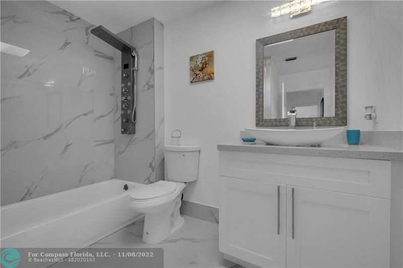 22341 Sea Bass Drive Boca Raton, FL 33428 - Photo 30 of 52 a bathroom with a sink a toilet and a bathtub