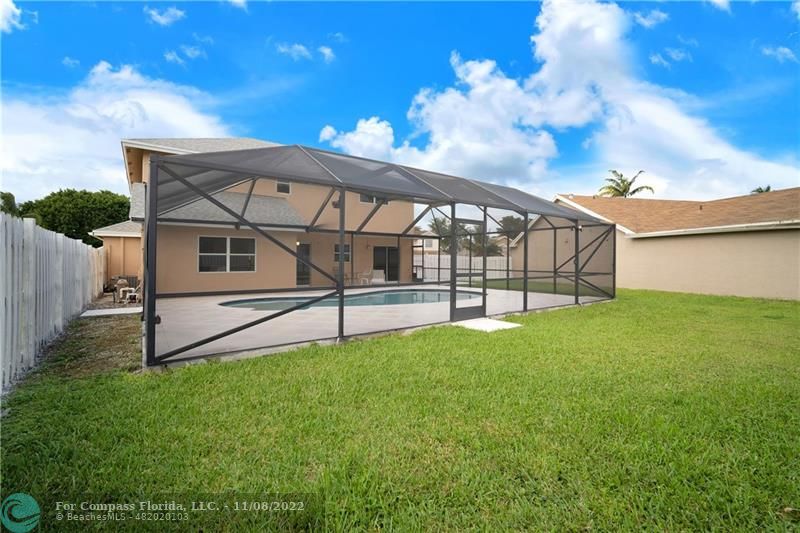 22341 Sea Bass Drive Boca Raton, FL 33428 - Photo 40 of 52 a view of a house with a yard