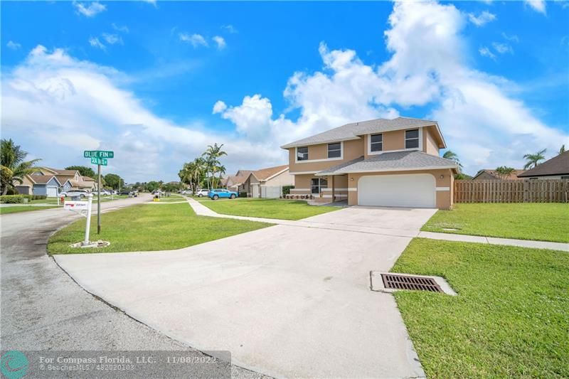 22341 Sea Bass Drive Boca Raton, FL 33428 - Photo 4 of 52 a view of a house with a swimming pool