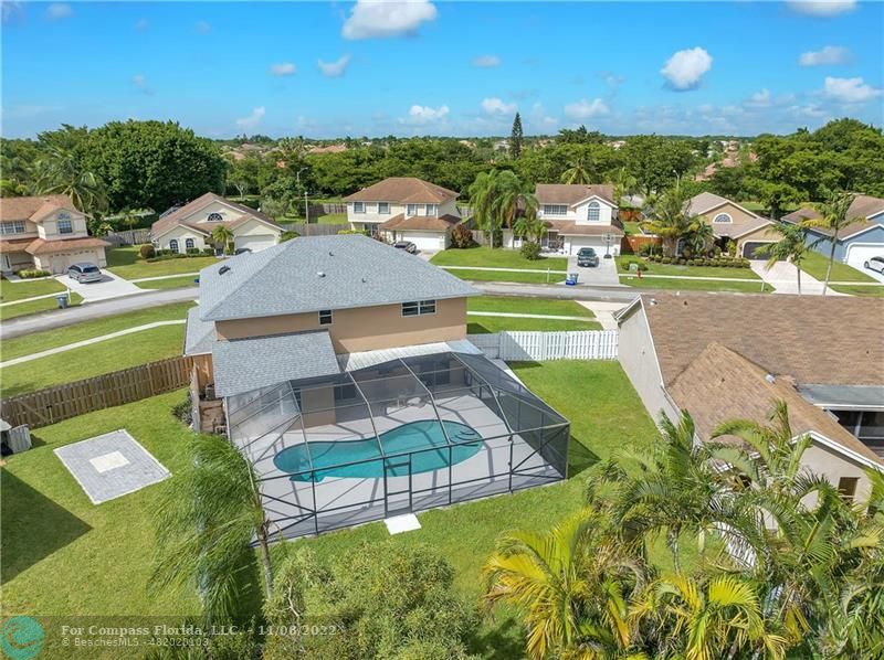 22341 Sea Bass Drive Boca Raton, FL 33428 - Photo 43 of 52 an aerial view of a house with a garden and swimming pool