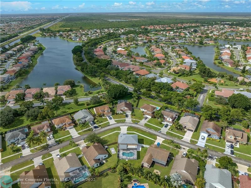 22341 Sea Bass Drive Boca Raton, FL 33428 - Photo 48 of 52 an aerial view of residential houses with outdoor space