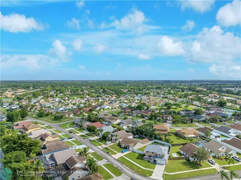 22341 Sea Bass Drive Boca Raton, FL 33428 - Photo 49 of 52 an aerial view of residential houses with outdoor space and trees