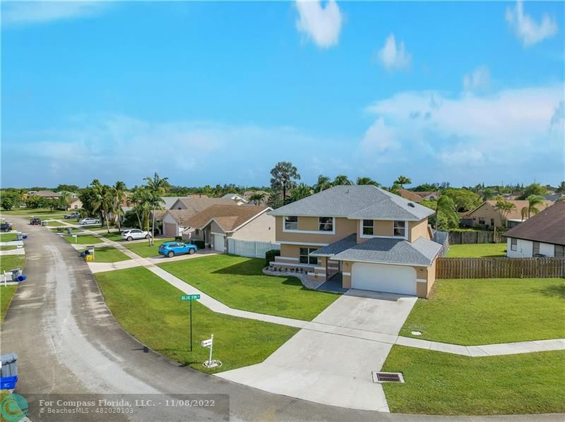 22341 Sea Bass Drive Boca Raton, FL 33428 - Photo 5 of 52 a view of a swimming pool with a patio