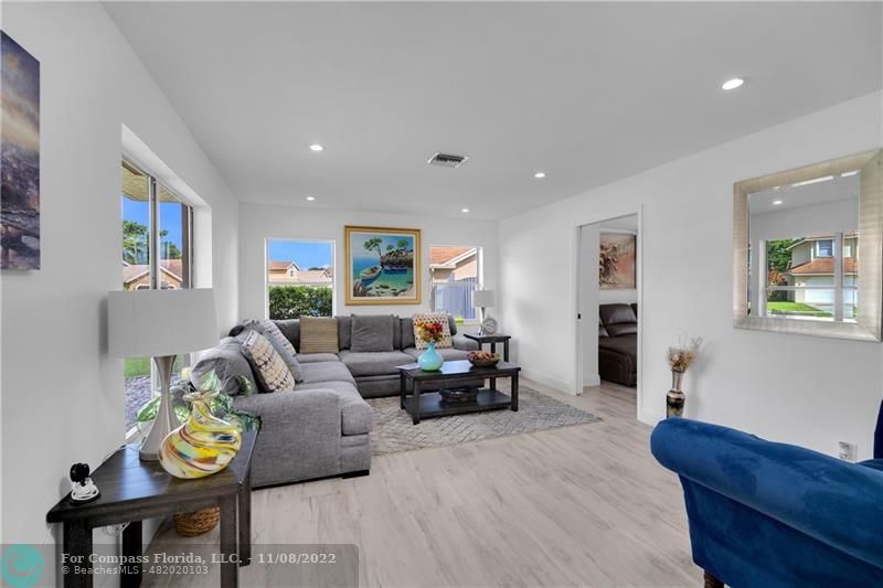 22341 Sea Bass Drive Boca Raton, FL 33428 - Photo 10 of 52 a living room with furniture and a wooden floor