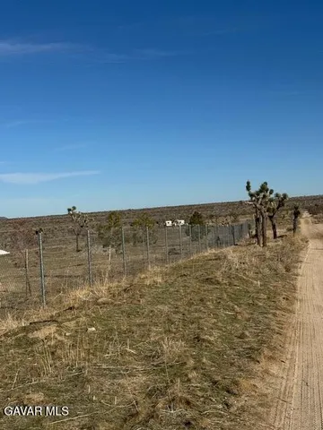 a front view of a house with parking space