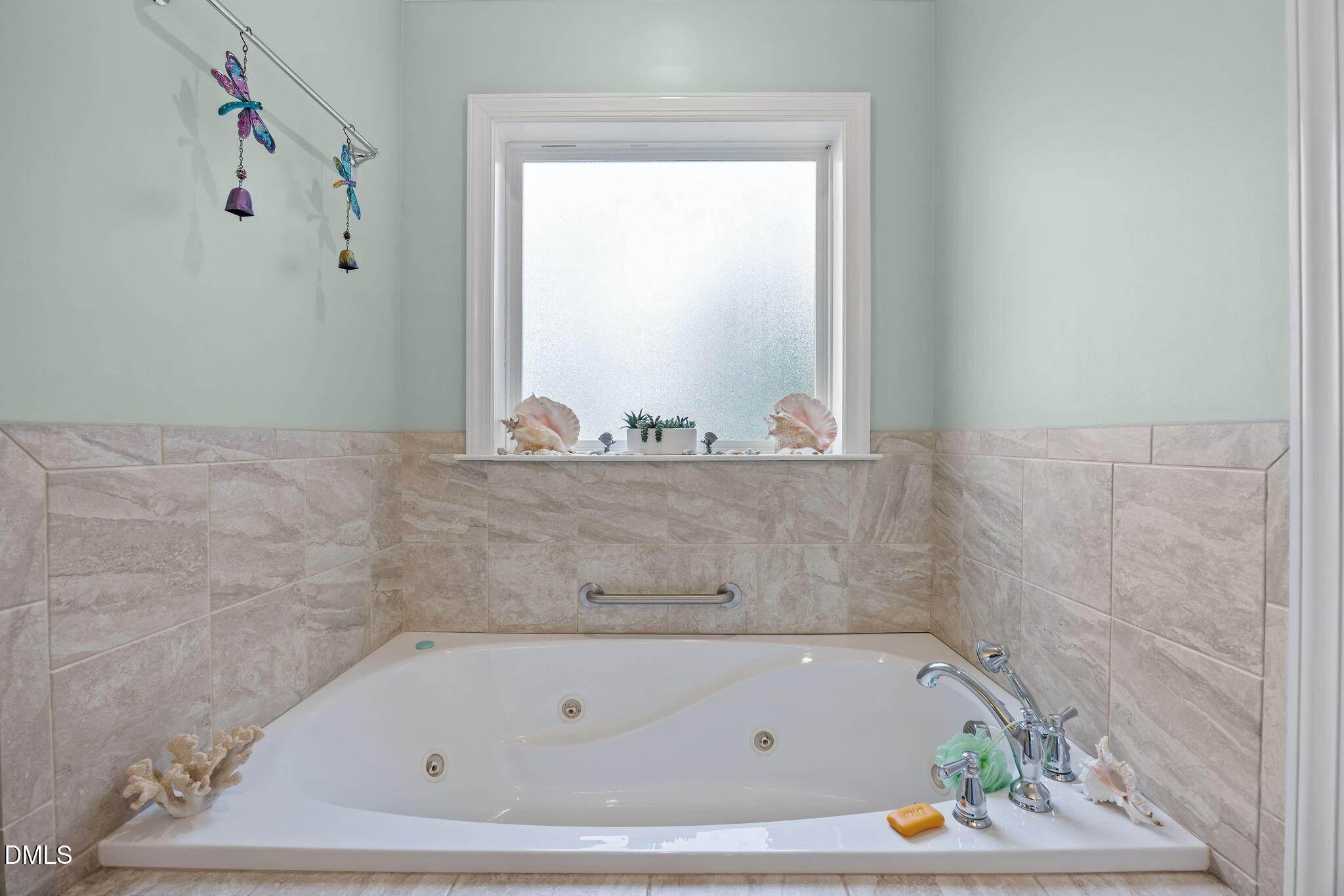 2880 Elevation Road Four Oaks, NC 27524 - Photo 27 of 51 a bathroom with a bath tub and a window