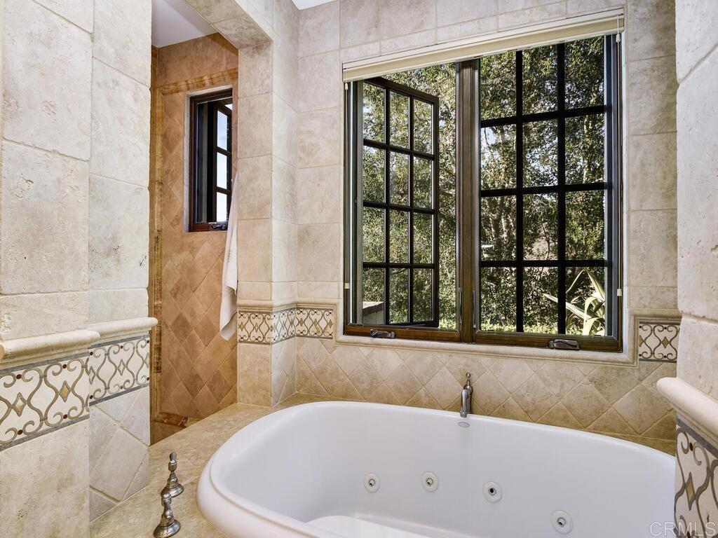 4272 Via Ravello Rancho Santa Fe, CA 92091 - Photo 34 of 58 a bathroom with bathtub and window