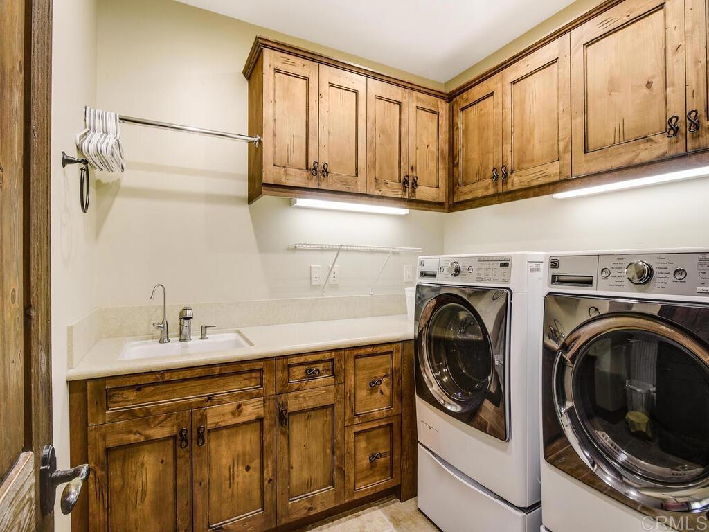 4272 Via Ravello Rancho Santa Fe, CA 92091 - Photo 38 of 58 a utility room with dryer and washer