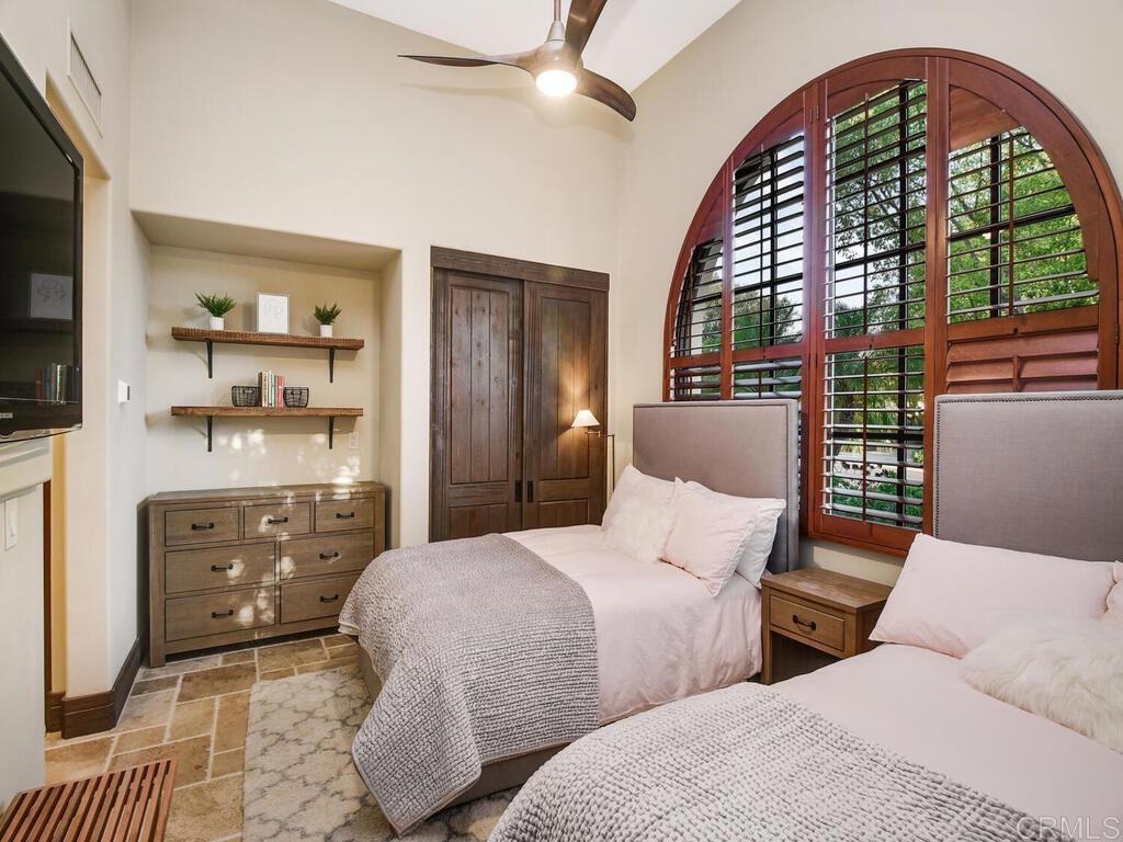 4272 Via Ravello Rancho Santa Fe, CA 92091 - Photo 39 of 58 a bedroom with two beds and a large window