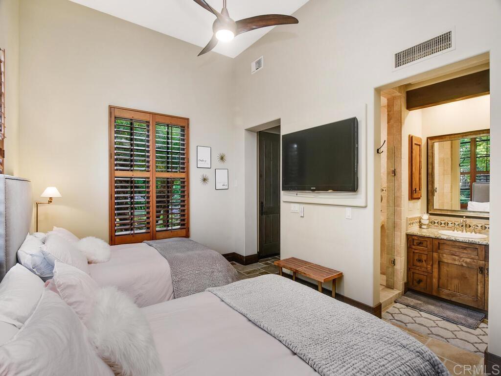 4272 Via Ravello Rancho Santa Fe, CA 92091 - Photo 40 of 58 a bedroom with a bed and a television