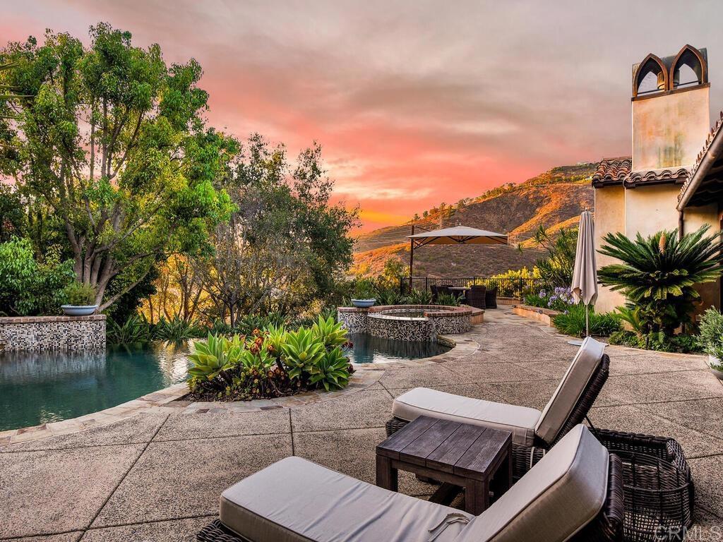 4272 Via Ravello Rancho Santa Fe, CA 92091 - Photo 43 of 58 a view of a patio with couches table and chairs and potted plants
