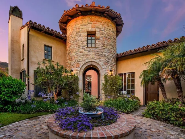 an aerial view of a house with outdoor space