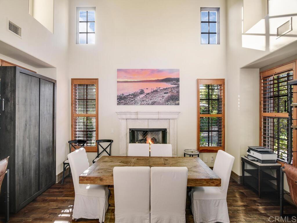 4272 Via Ravello Rancho Santa Fe, CA 92091 - Photo 8 of 58 a living room with furniture a fireplace and large windows