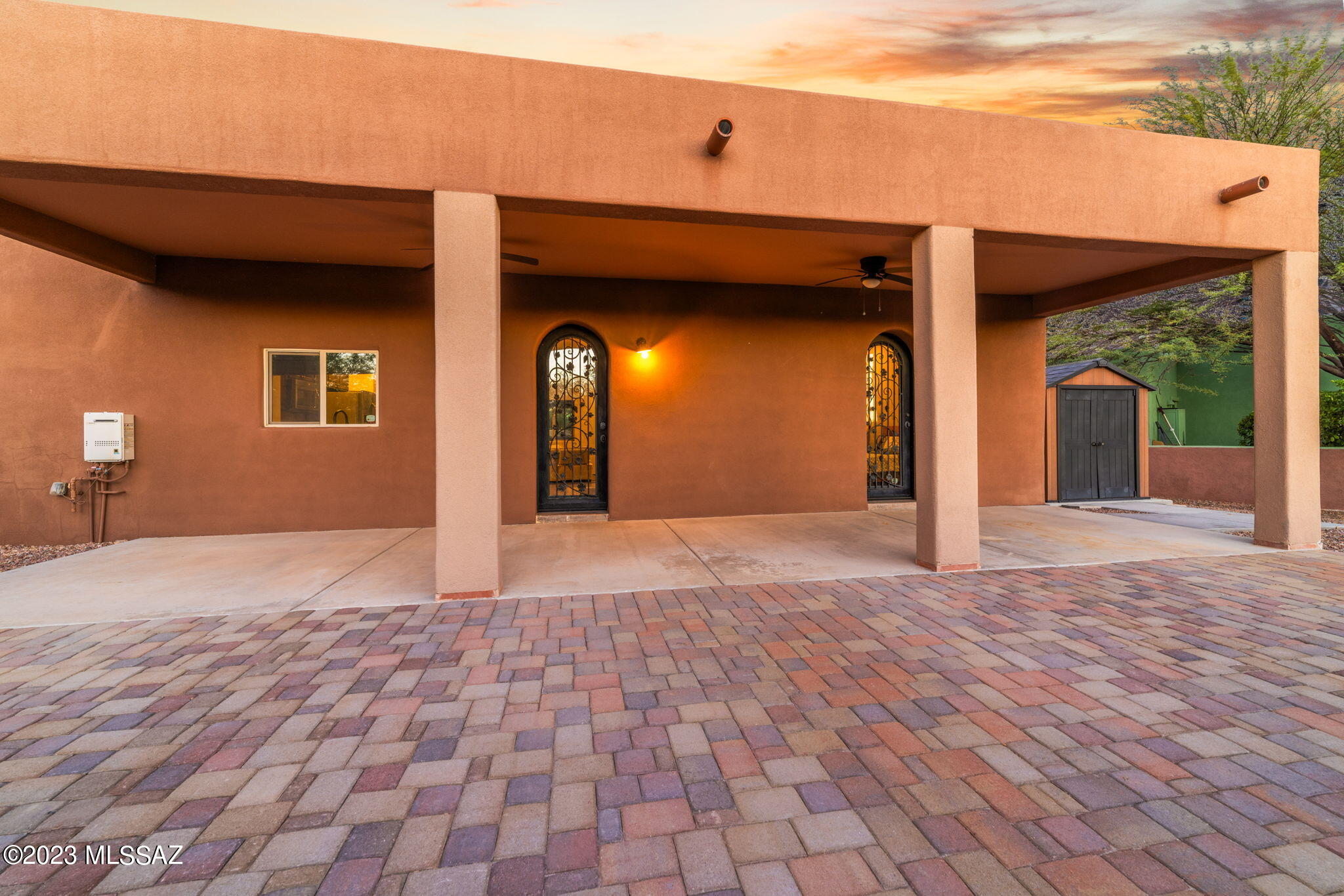 5670 Triangle X Place Tucson, AZ 85713 - Photo 6 of 36 a view of a house with a wooden bench
