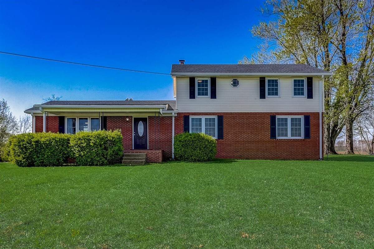 555 White Road Portland, TN 37148 - Photo 1 of 30 a view of a brick house with a yard