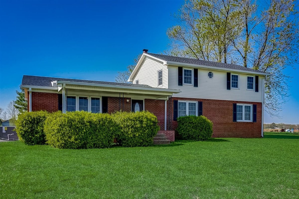 555 White Road Portland, TN 37148 - Photo 2 of 30 a view of a brick house with a yard